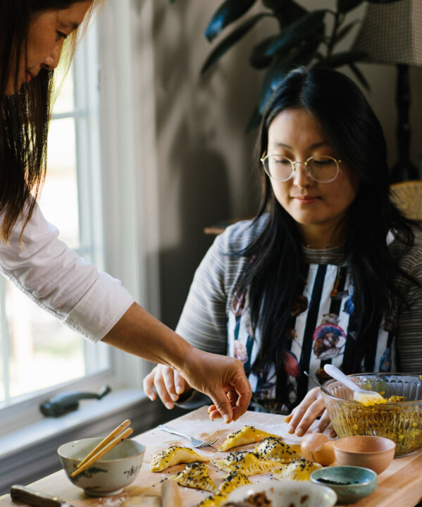 Judy sprinkling sesame seeds