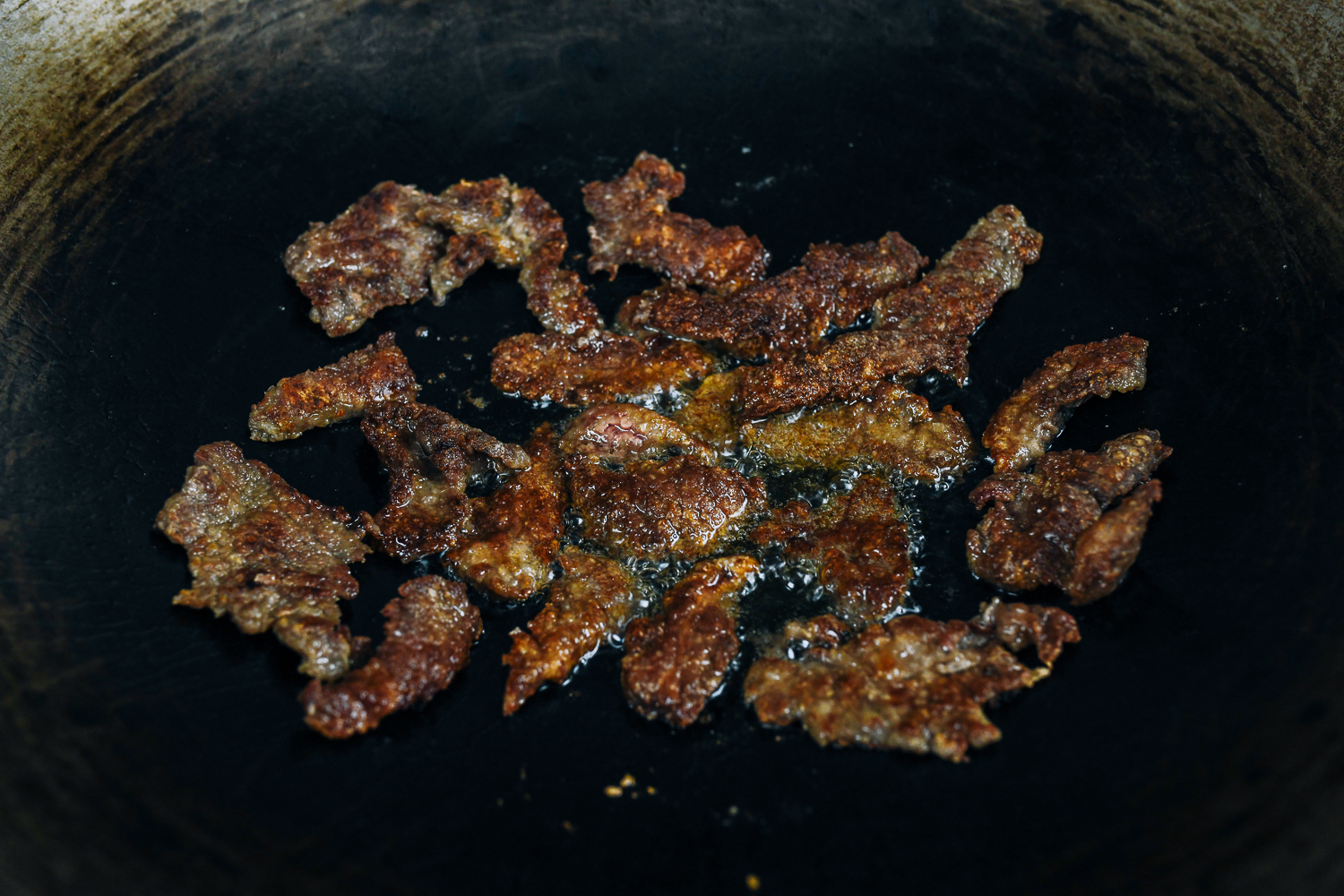 crispy beef slices in wok