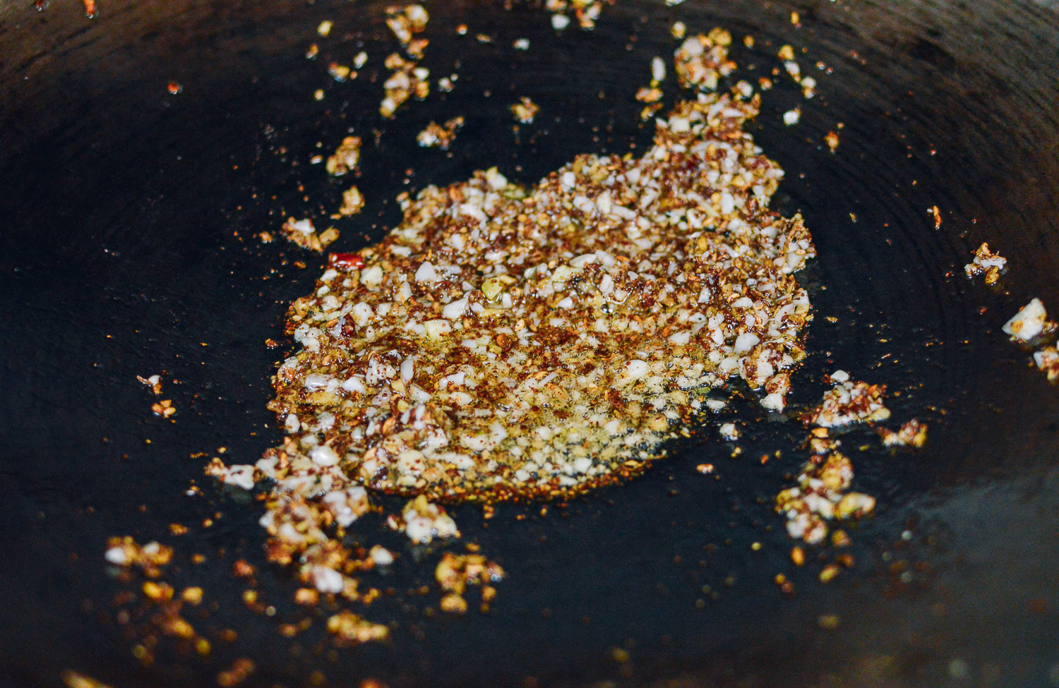 Frying sichuan peppercorns, ginger, and garlic, thewoksoflife.com